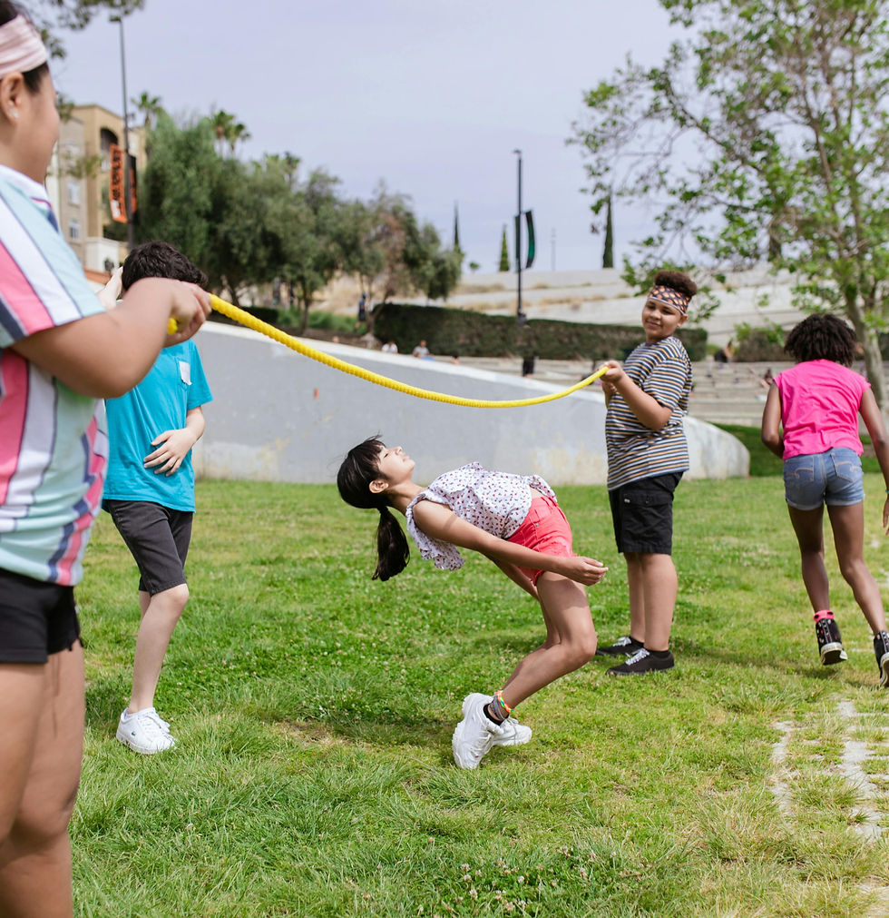 Children playing a game of limbo at a birthday party
