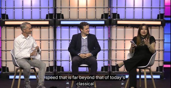 Tech journalist Mary-Ann Russon chairing a quantum computing panel discussion as a keynote speaker with IBM's Juan Bernabe Moreno and Airbus' Mirko Reuter at Web Summit 2025.