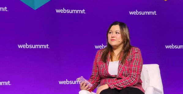 Tech journalist Mary-Ann Russon chairing a panel discussion as a keynote speaker at Web Summit 2022.