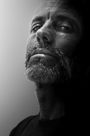 black and white portrait of a man looking at the camera