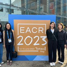 Carmen and lab members at EACR 2023.jpeg