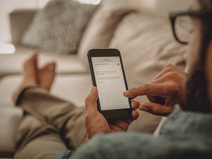 man looking at phone