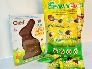 No Whey Foods vegan Easter treats: a chocolate bunny box and bright yellow Mini Cream Eggs bags on a white background