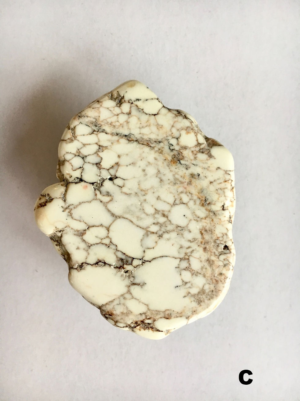 Thumbnail: Close-up of a white and brown stone with intricate vein patterns