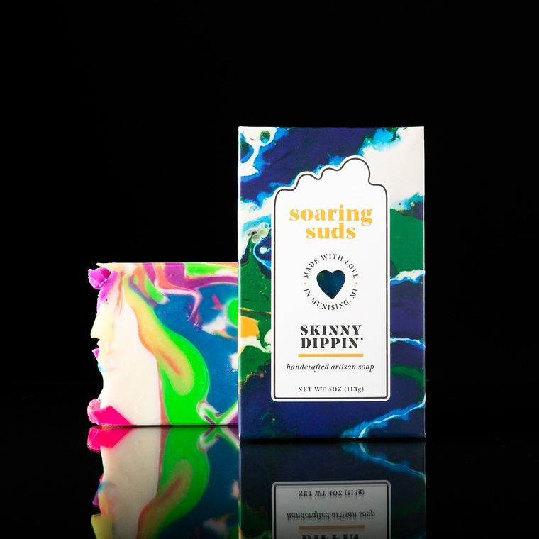 Thumbnail: Soaring Suds Skinny Dippin' soap bar with colorful marbled design on black