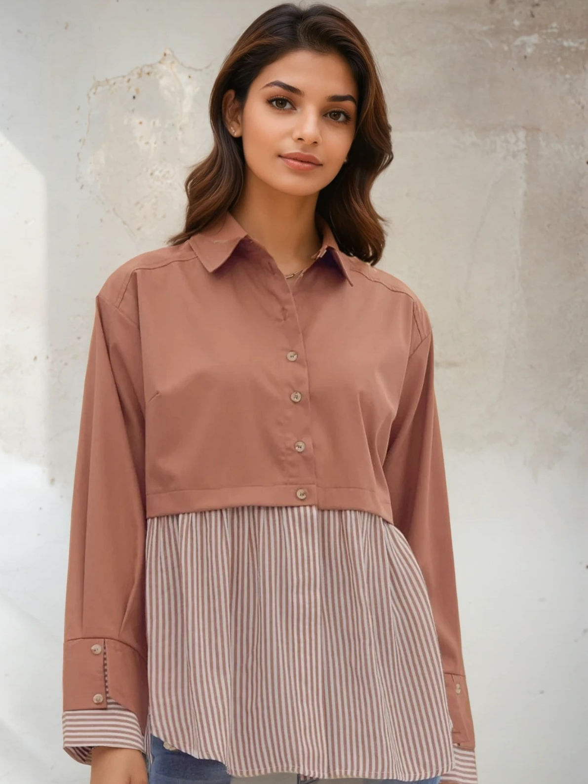 Woman wearing brown shirt and striped skirt, Perfectly Paired Blouse, posing indoors.