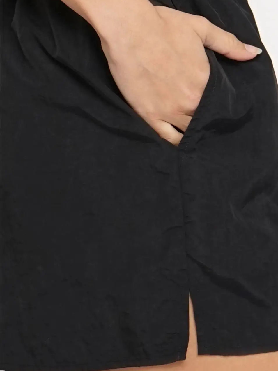 Thumbnail: Hand in black shorts pocket, athletic wear, close-up, detail shot