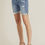 Thumbnail: Woman wearing denim shorts with heels, Off White Denim Shorts, casual style.