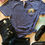 Thumbnail: Blue shirt with happy rainbow, jeans, and sneakers styled casually