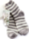 Cozy Season hand cream and striped socks for the ultimate comfort.