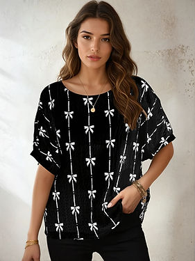 Woman wearing a bow print top from an online women's boutique