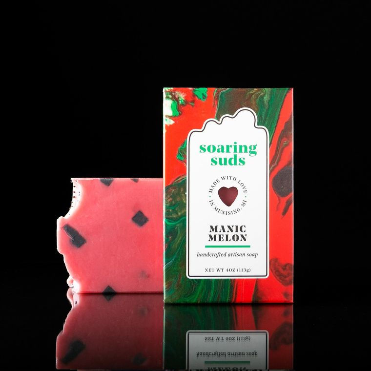 Thumbnail: Manic Melon soap with "Soaring Suds" branding and a bitten-off piece.