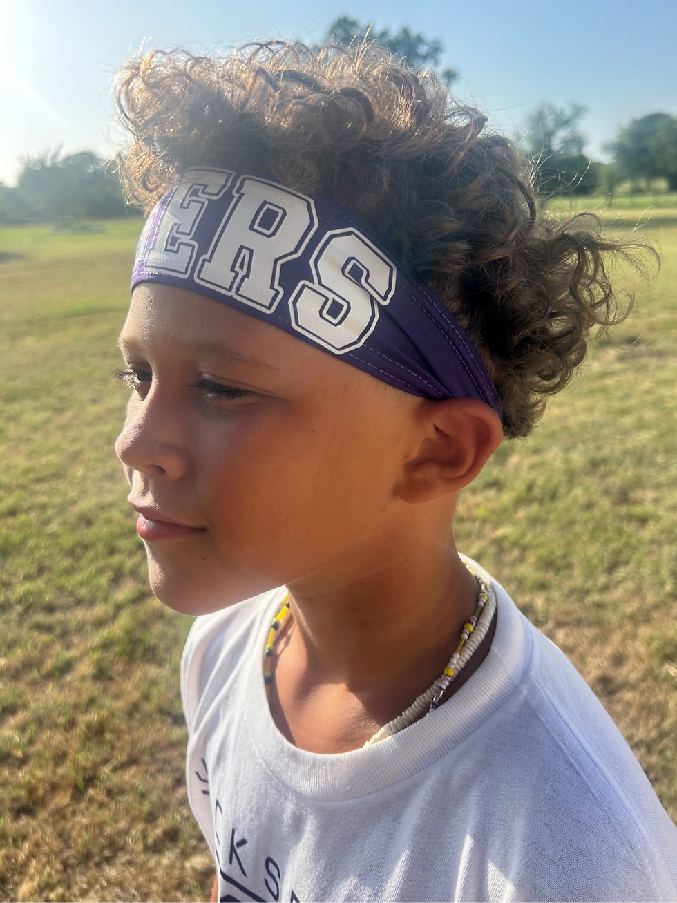 Thumbnail: Cute boy wearing a purple sport headband with tigers graphic