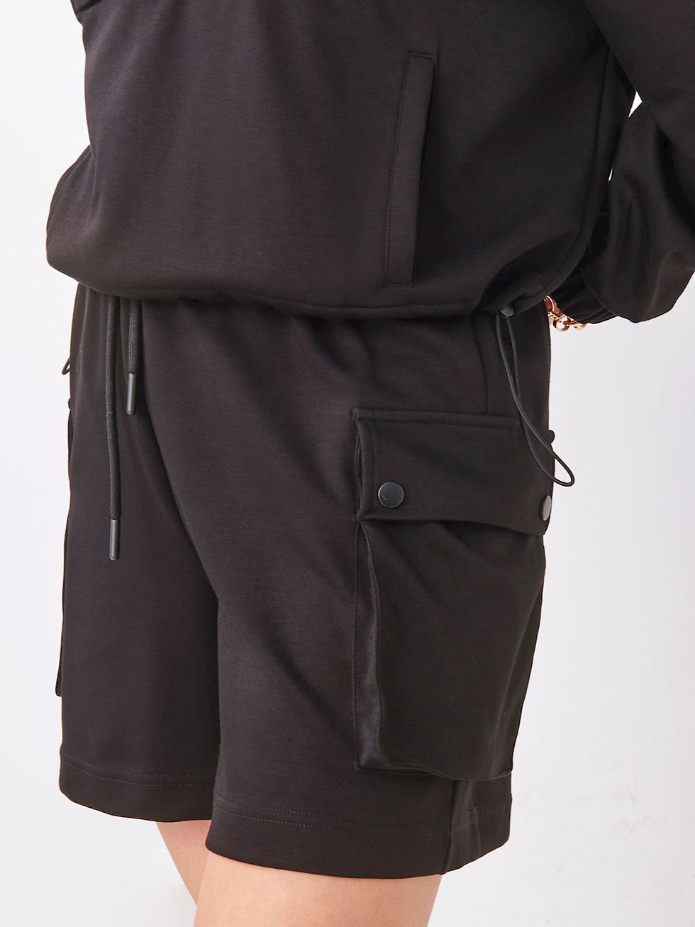 Thumbnail: Black shorts with pocket and drawstring, casual clothing for wear.