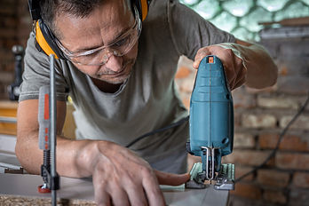 Worker on a Kitchen remodeling cabinets