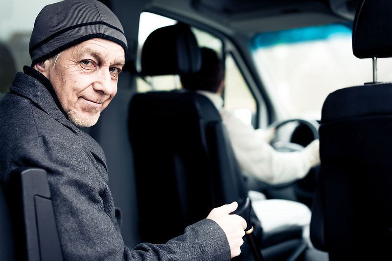 Senior Man Sitting In Paratransit Van