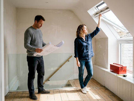 Couple reviewing London loft conversion plans