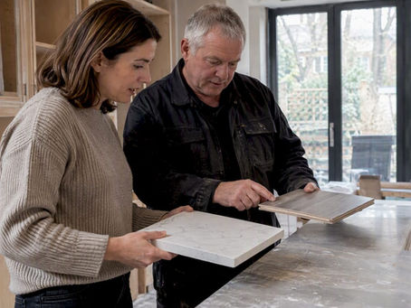 Homeowner comparing kitchen worktop variation samples