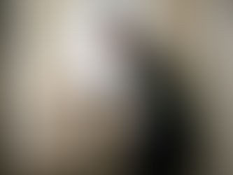 Homeowner inspecting tile in West London bathroom