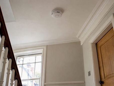 Smoke alarm fitted on a townhouse landing ceiling