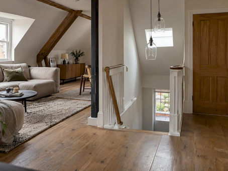 Open-plan loft beside its enclosed staircase