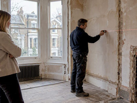 Contractor measuring Victorian townhouse refurbishment