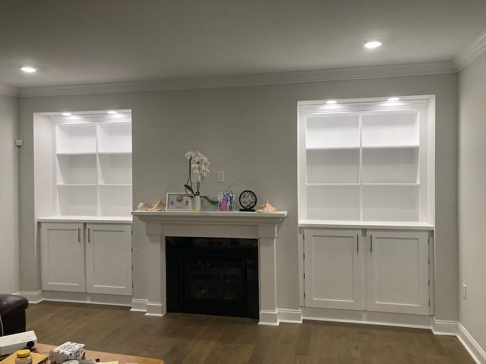 Custom built-in shelving and fireplace cabinets by Triangle Repairs LLC in Chapel Hill, NC.