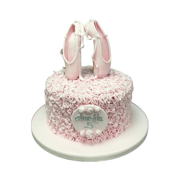 Bespoke celebration cake with pink ballet shoes and delicate ruffles, crafted in Solihull, West Midlands.