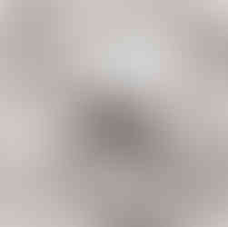 close up of raw cotton balls on top of fabric draped with soft folds