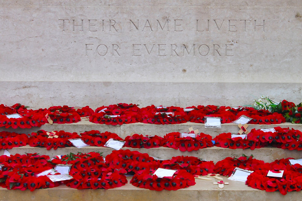 war memorial with red poppies