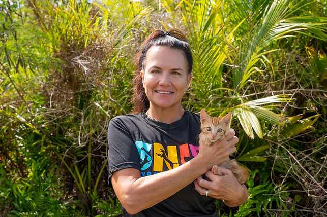 Dr. Amber posing in Guam with one of her kitten patients