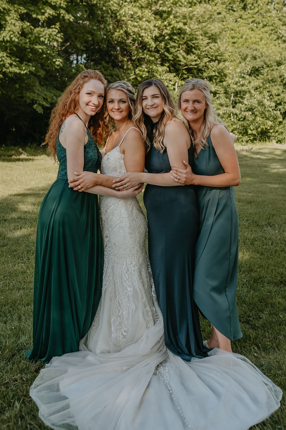 Bridesmaids with bride at Graye's Greenhouse in Metro Detroit. Michigan wedding photography by Nicole Leanne Photography