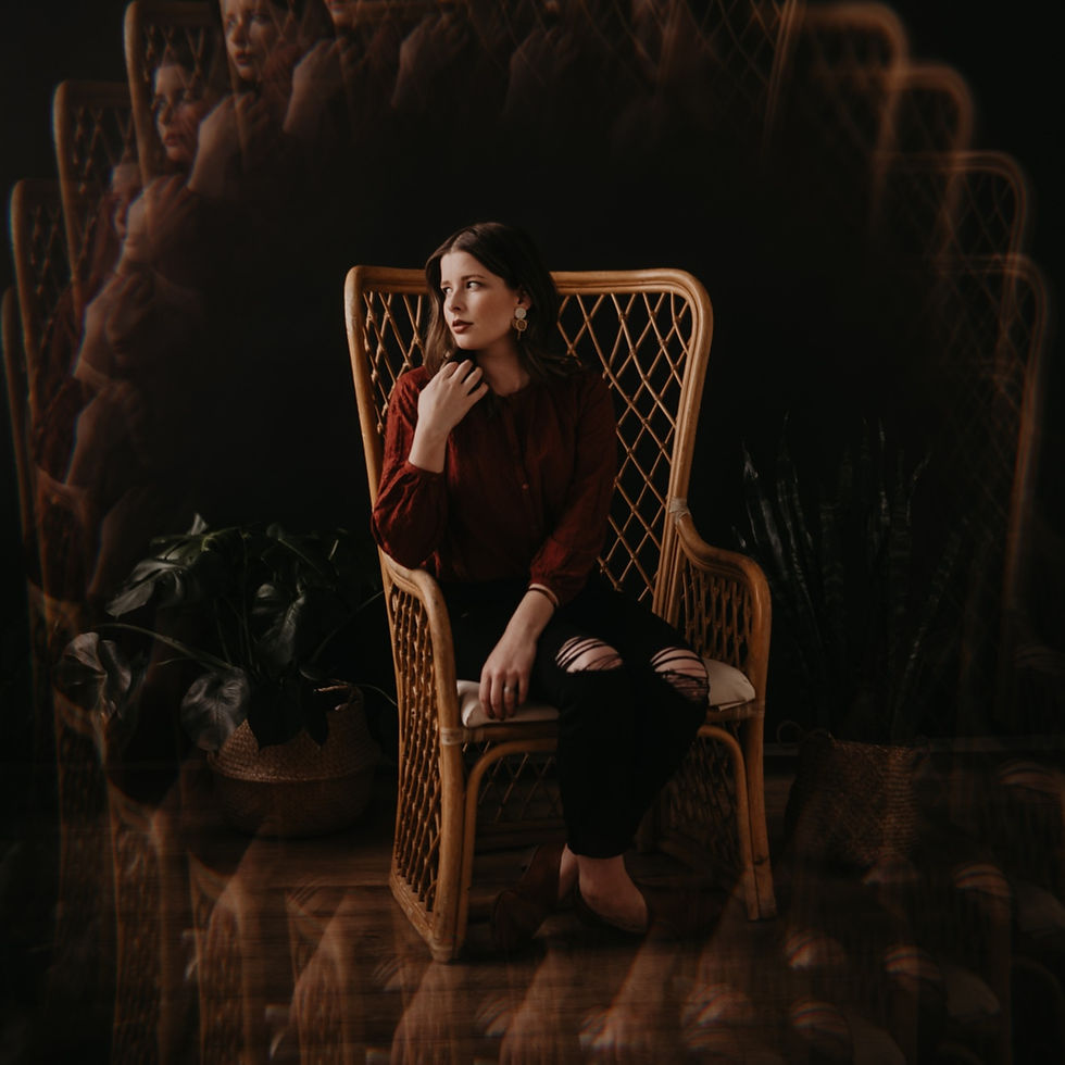 neurodivergent entrepreneur sitting in chair with moody lighting