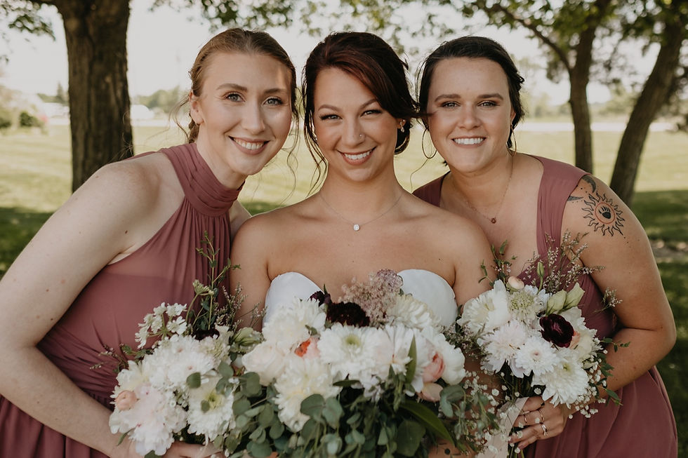 Bride with bridal party at wedding. Photographed by Nicole Leanne Photography.