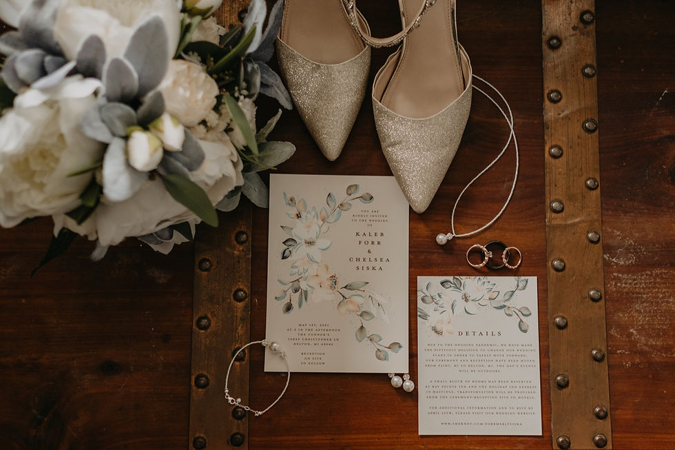 Flat lay of wedding details and accessories. Photography by Nicole Leanne Photography