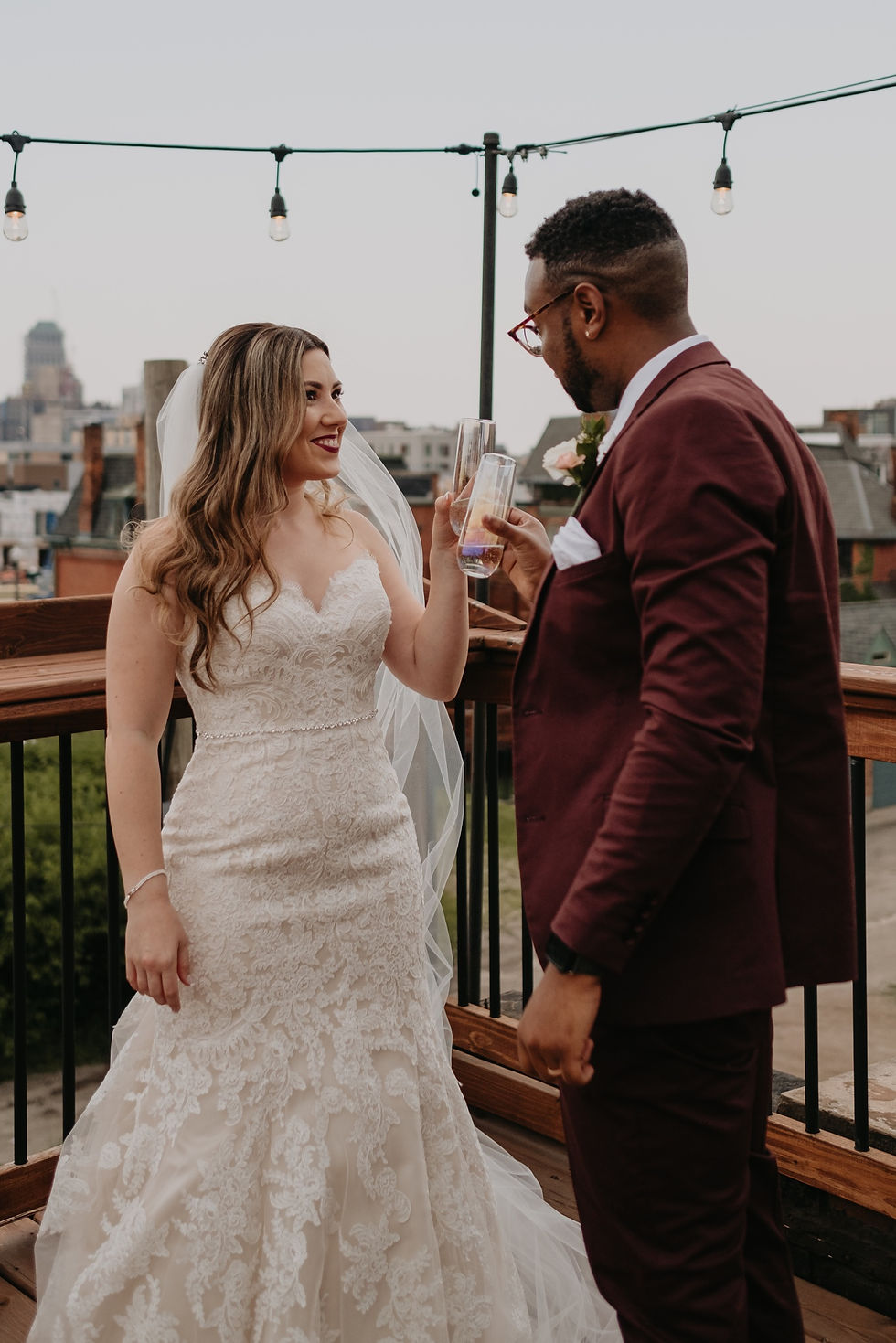 Bride and groom champagne toast at Detroit elopement. Lifestyle documentary wedding photography by Nicole Leanne Photography