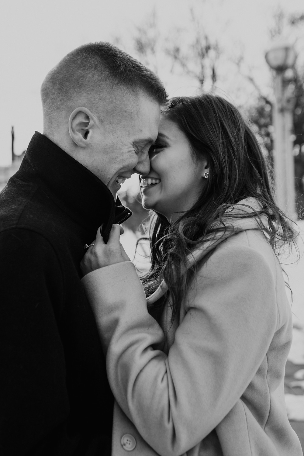 Black and white photo of couple during engagement session in Detroit. Photographed by Nicole Leanne Photography.