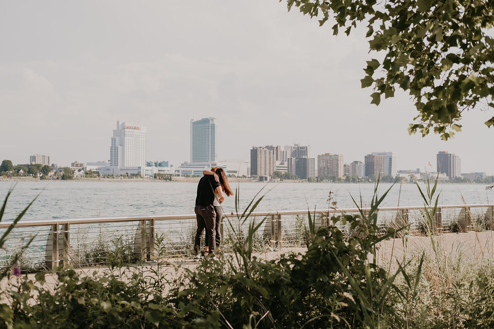 Canada skyline in background with Detroit proposal. Photographed by Nicole Leanne Photography