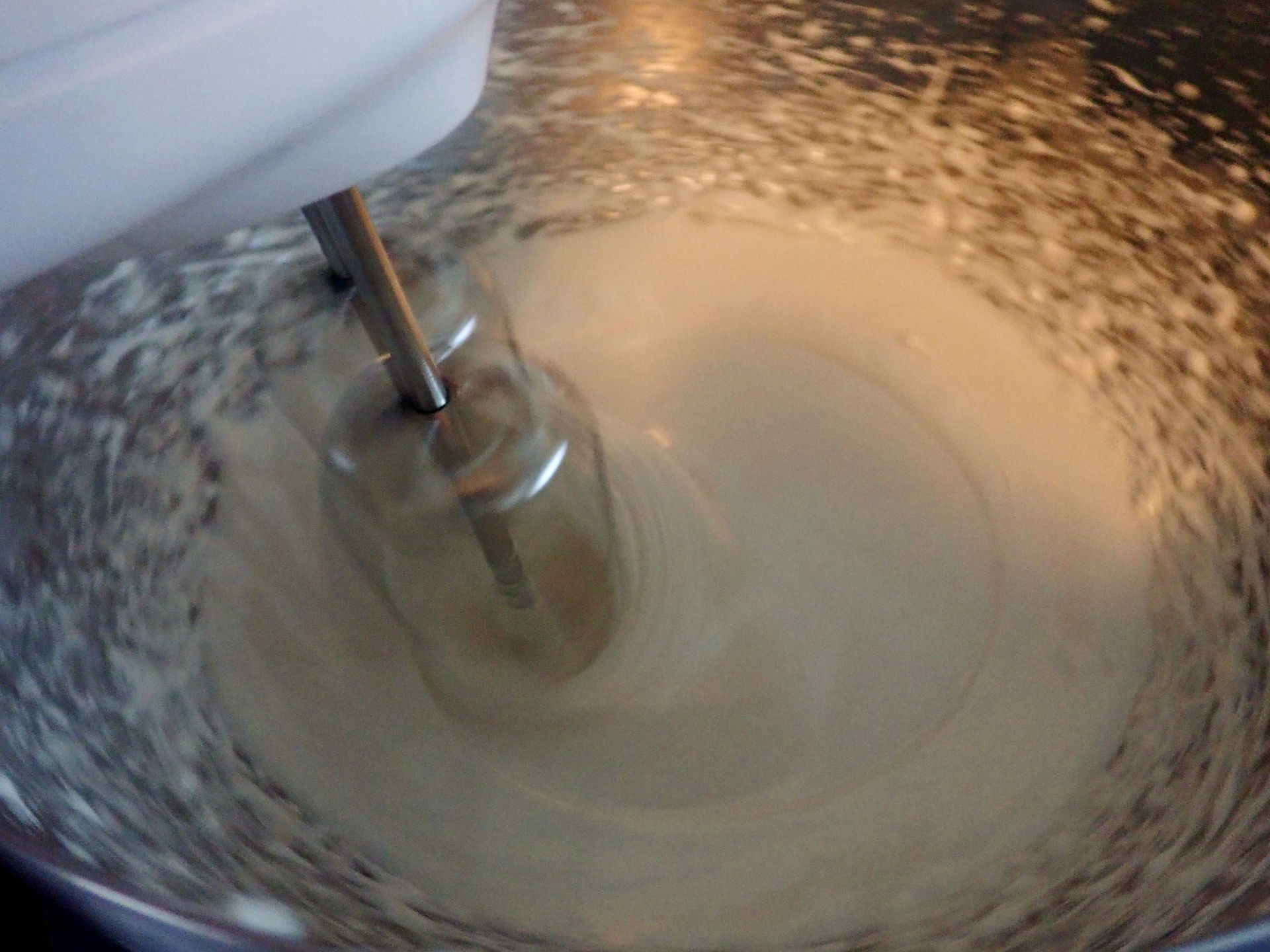 Beaters whipping egg whites and maple sugar for cinnamon and sahlep macarons. Image to accompany recipe for cinnamon and sahlep macarons on food blog Forays into Food.