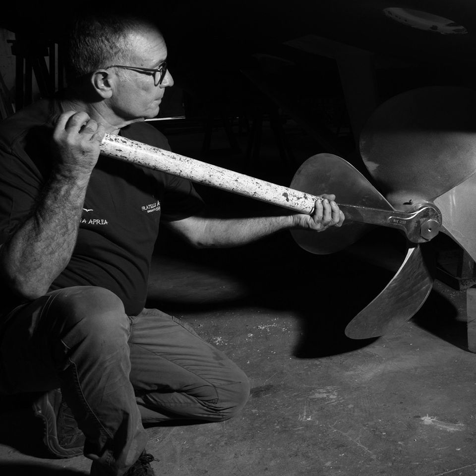 Craftsmen working on shaft line