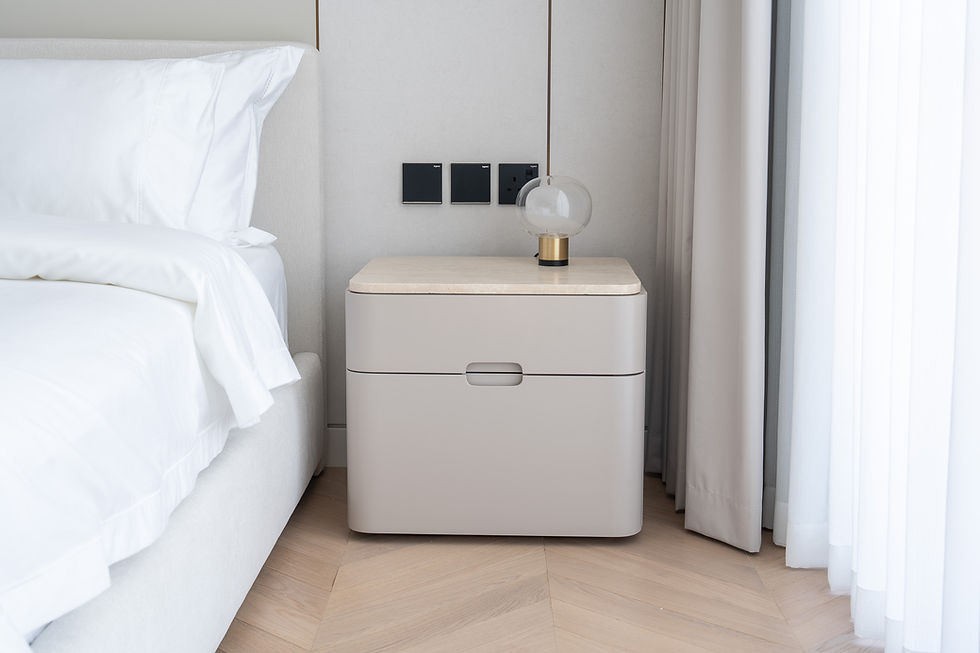 Avena travertine bedside table in Dubai with curved design and genuine travertine top by Adams Furniture
