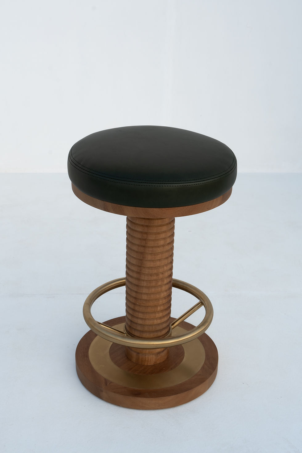 Thumbnail: Green leather round bar stool with ribbed solid teak column and Art Deco brass footring