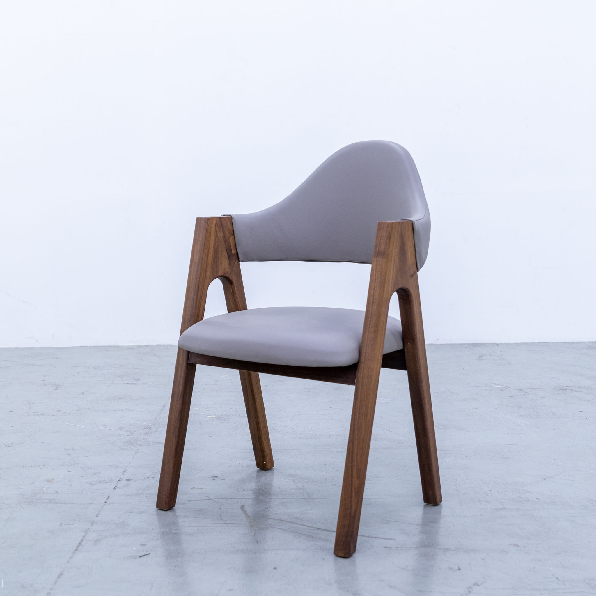 walnut dining chair with leather upholstery in dubai