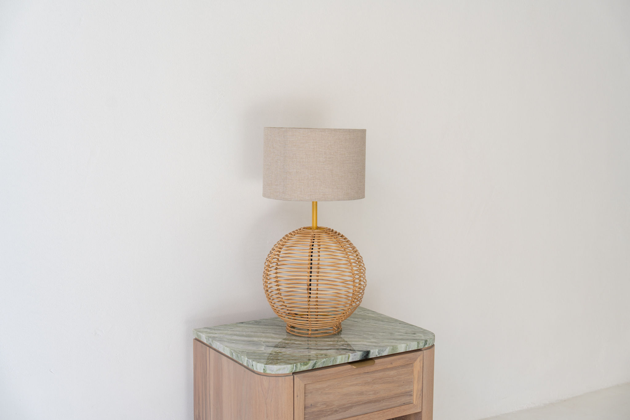 Rattan Globe Bedside Table Lamp with woven rattan base and linen shade