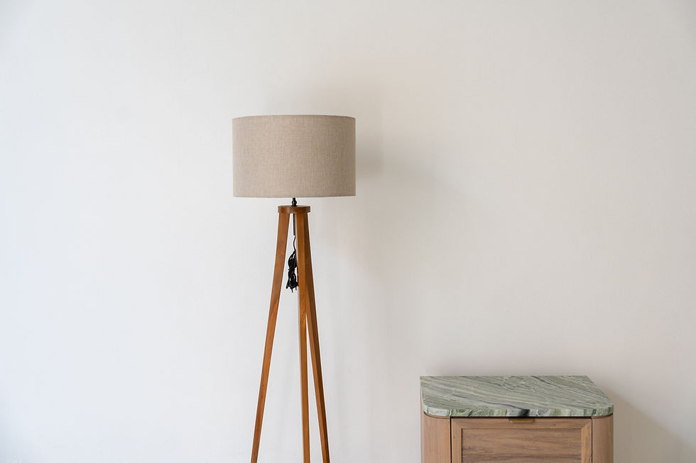 Thumbnail: Close-up of linen drum shade on wooden tripod floor lamp