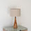Thumbnail: Solid teak wood table lamp in Dubai with tapered spire base and drum lampshade