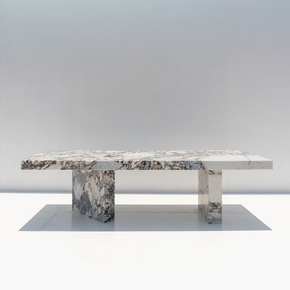 Large luxury marble dining table with natural grey, cream and white stone veining by Adams Furniture Dubai.