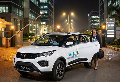 A Women Getting In To Rego Employee Transportation Service Office Cab