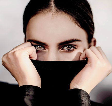 woman-covering-her-face-with-black-texti