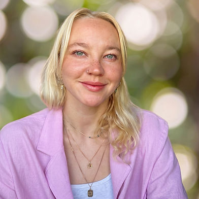 Portrait of Luna Mertins, a compassionate therapist with a calm presence, reflecting her inclusive, trauma-informed approach to counseling